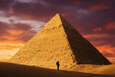 Happy tourists at Giza Pyramids during a Cairo day trip from Hurghada in 2026.