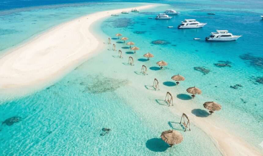 Aerial view of Orange Bay Island in Hurghada featuring white sands and turquoise waters, known as the Egyptian Caribbean.