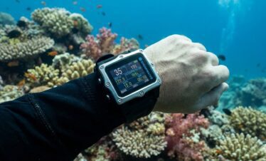 Diver checking dive computer between dives
